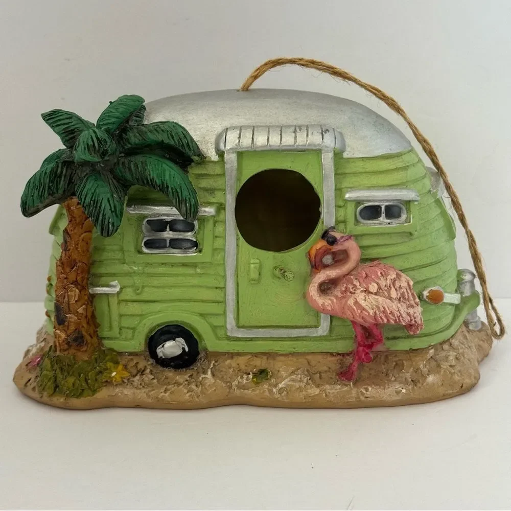 decorative resin RV camper birdhouse with a flamingo and a palm tree